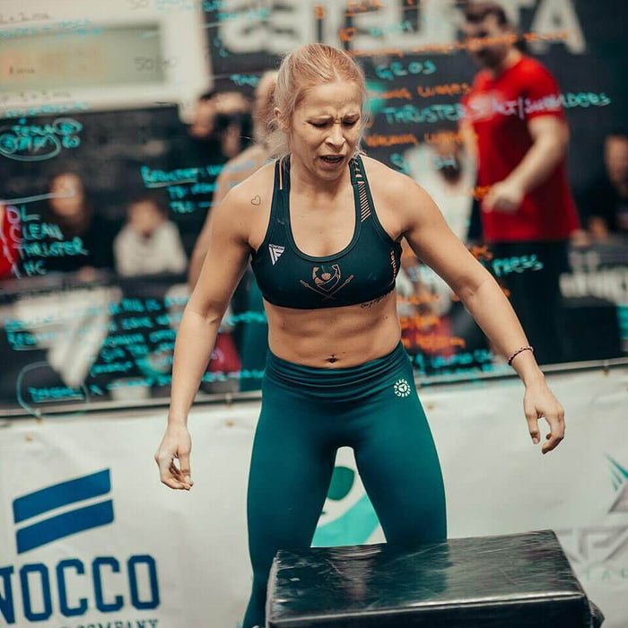 An athlete performing explosive box jump training