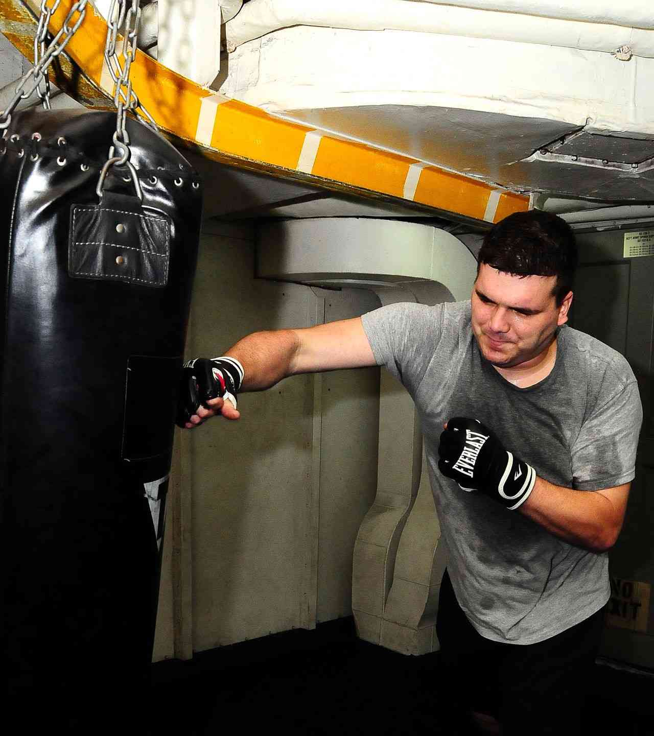 Trainer practicing on a punching bag