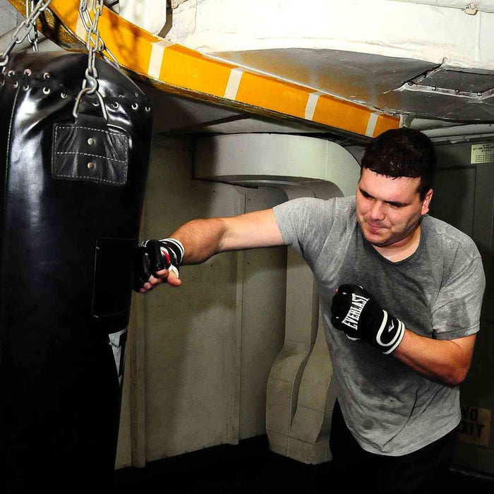 Trainer practicing on a punching bag