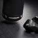 Black boxing glove with Hayabusa branding on a dark textured surface