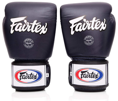 Pair of black Fairtex boxing gloves on a white background