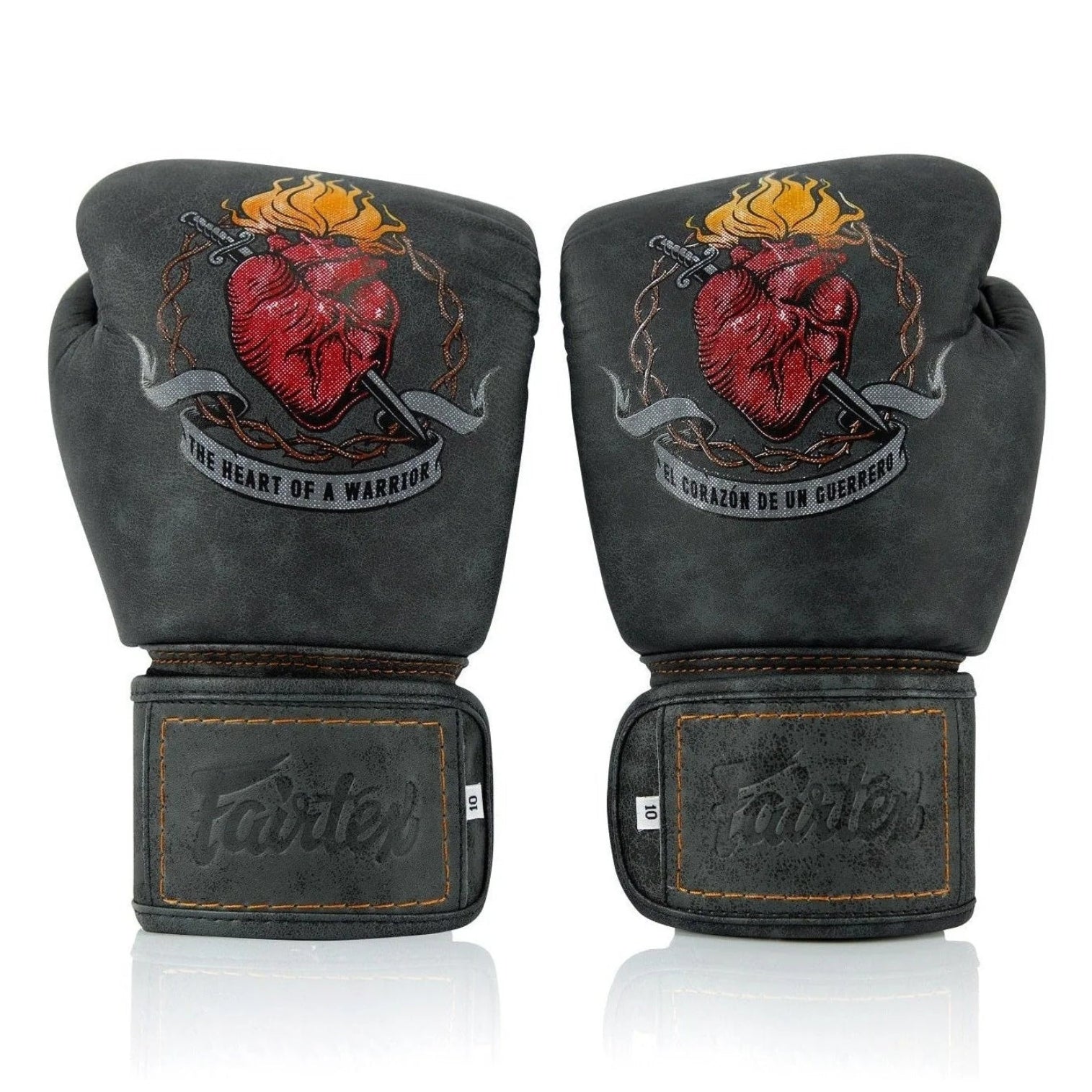 A pair of black leather boxing gloves with a red anatomical heart graphic and a dagger, featuring the Fairtex logo on the wrist straps, set against a plain white background.