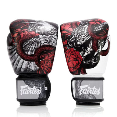Pair of boxing gloves with snake and flower design on a white background
