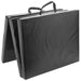Black folding mat with handles on a white background