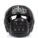 A black Fairtex boxing headguard with a white script logo on the forehead, shown against a plain white background.