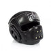 A black Muay Thai headguard with a white 'Fairtex' logo on the forehead, shown on a clean white background.