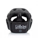 A black Fairtex boxing headguard with white logo branding, shown from a front three-quarter angle on a clean white background.