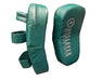 A pair of teal green UFC Slayer boxing and MMA fight gear hand pads shown on a dark, reflective surface. One pad is shown from the side with its straps, and the other is shown from the front displaying the white UFC branding.