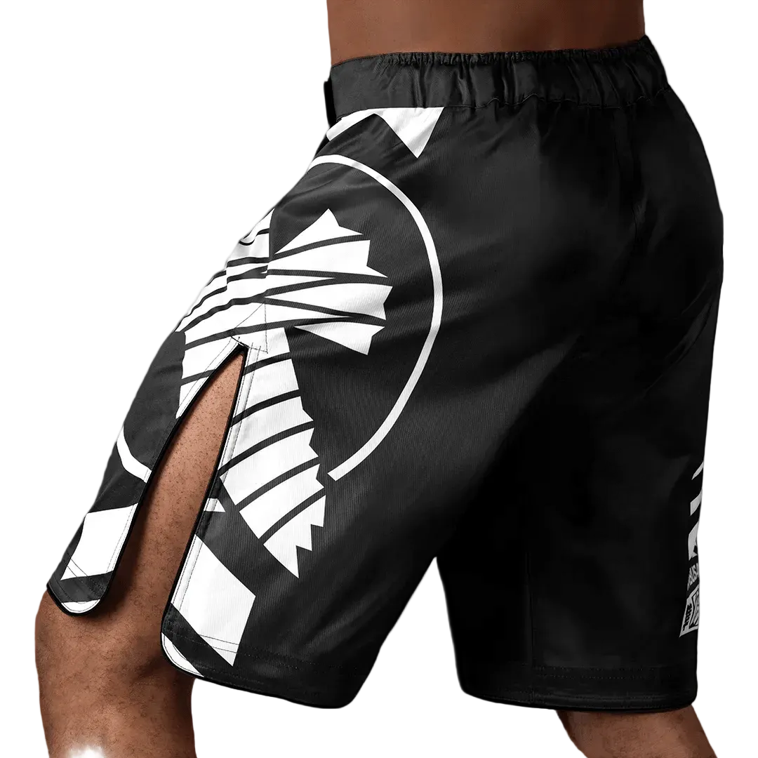 Black athletic shorts with white geometric design on a white background