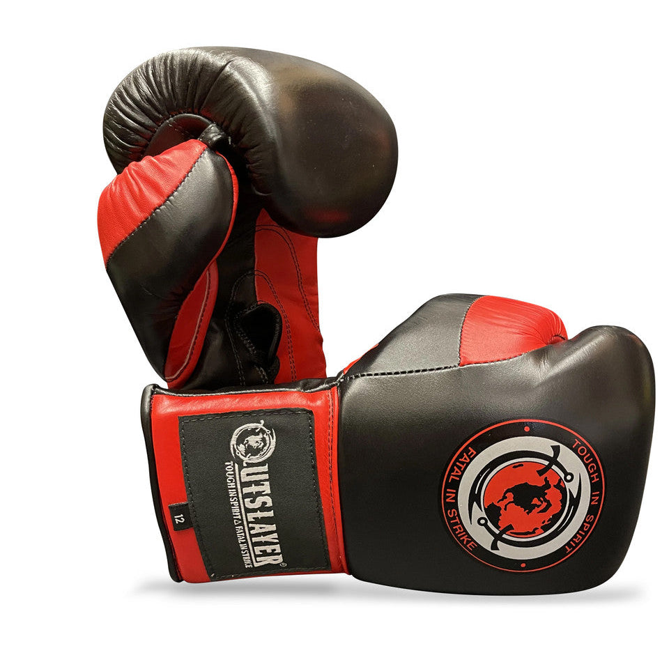 Pair of black and red boxing gloves with a visible brand logo on a white background