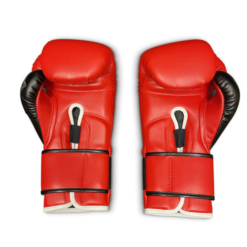 Pair of red boxing gloves with black accents on a white background